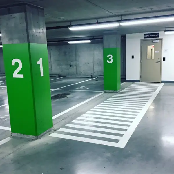 Colour banded columns on underground parking level Colour banded columns on underground parking level