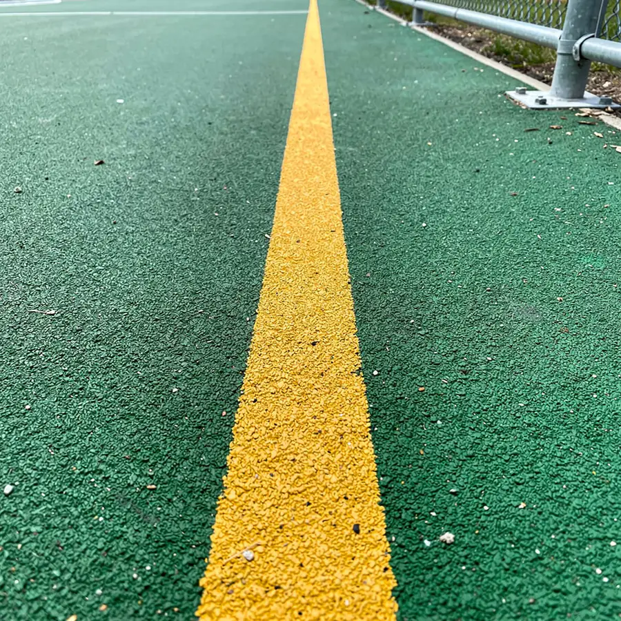 Coloured court lines on green acrylic surface Coloured court lines on green acrylic surface