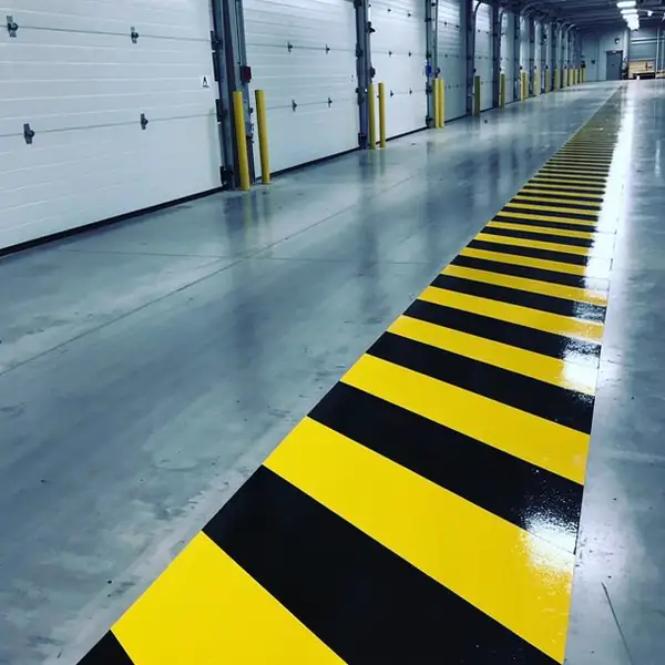 Epoxy hazard stripes on warehouse dock edge