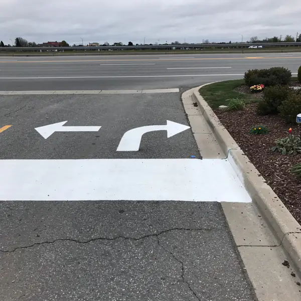 Fresh arrows and stop bar plaza exit