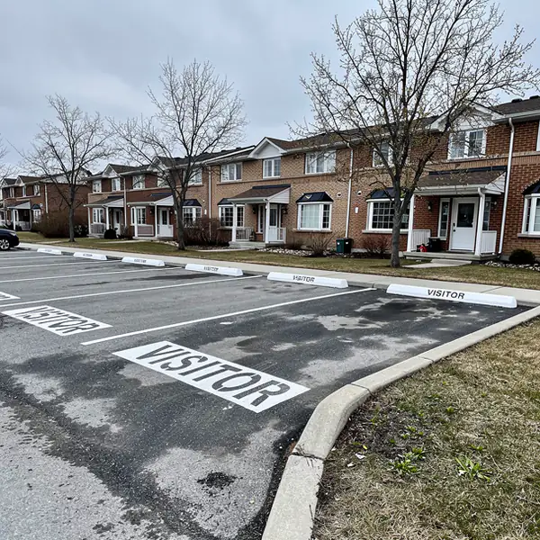Freshly restriped condo lot after winter