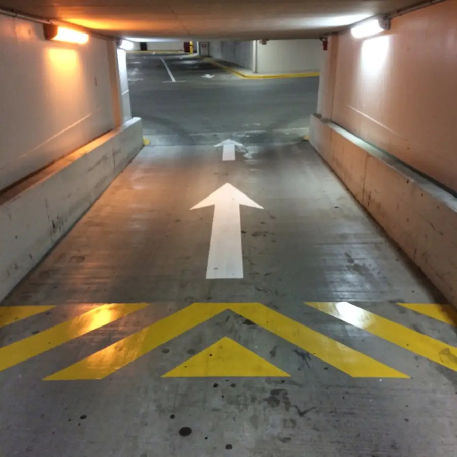 Garage ramp with painted arrows and chevrons Garage ramp with painted arrows and chevrons