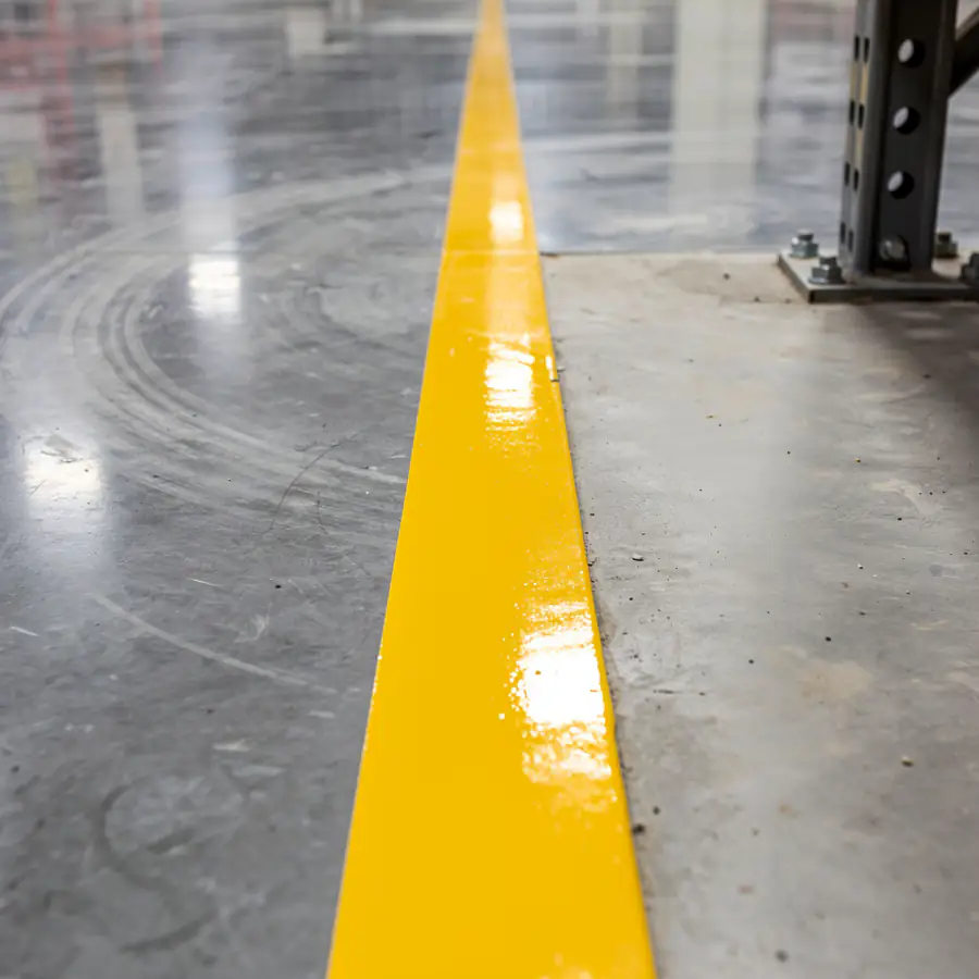 Ground concrete strip with new epoxy line