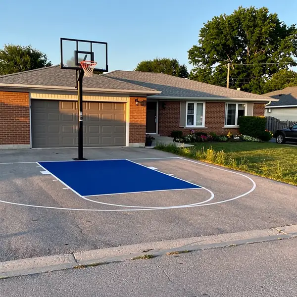 Painted blue key on driveway basketball court