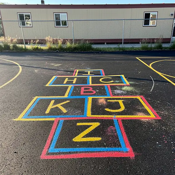 Painted hopscotch and four square school yard