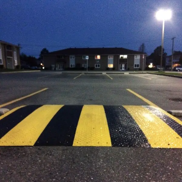 Reflective beaded speed bump stripes at dusk