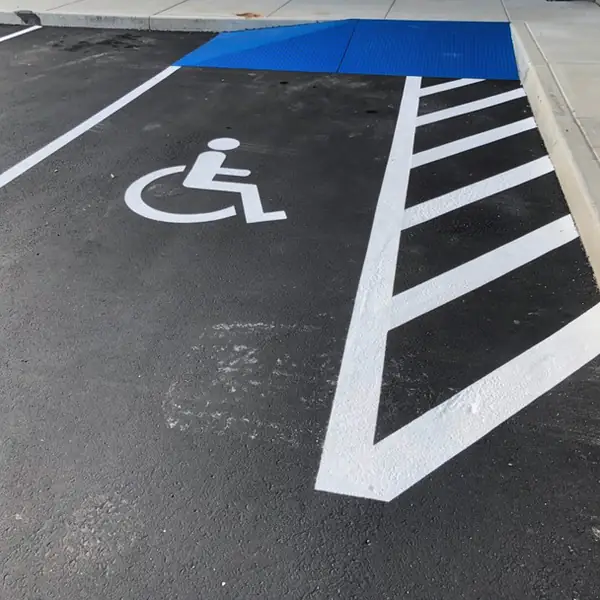 Van accessible stall with wide hatched aisle